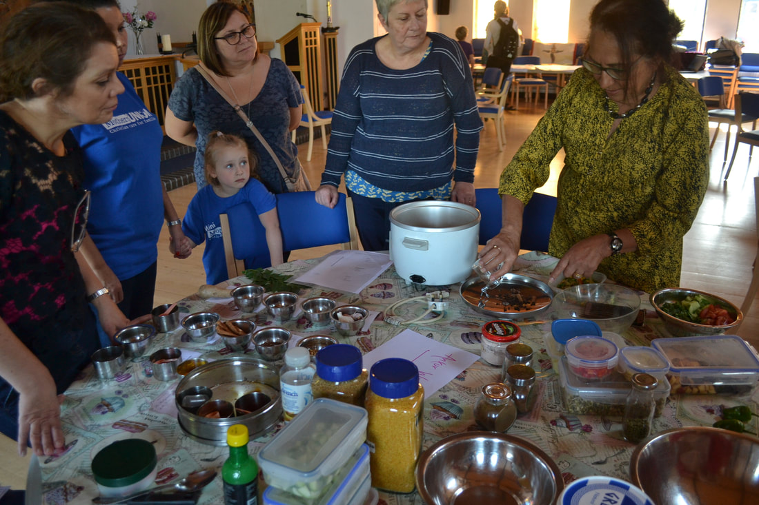 A cooking demonstration at one of our Faith & Climate events